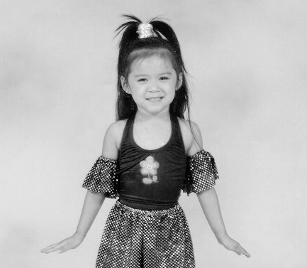 Teya as a young dancer in a dance costume